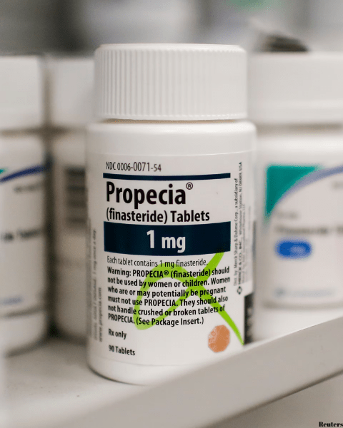 Propecia (Finasteride) Tablets on a shelf in drug store